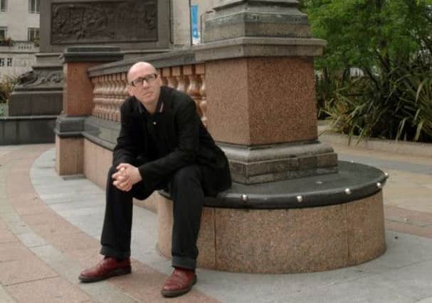 Author David Peace in  City Square in Leeds