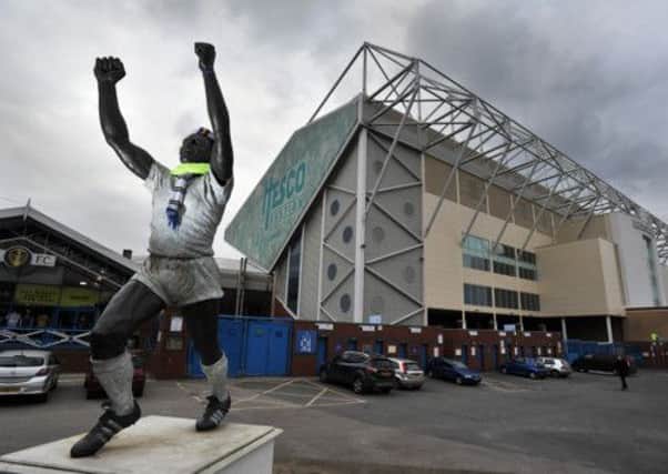 The Billy Bremner statue and the East Stand, Elland Road Stadium.