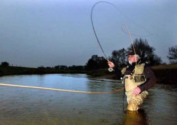 Fly fisherman Roger Beck on the River Rye at West Ness near Malton.