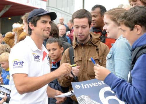 England's Alastair Cook signs autographs after the Third Investec Ashes test match ended in a draw