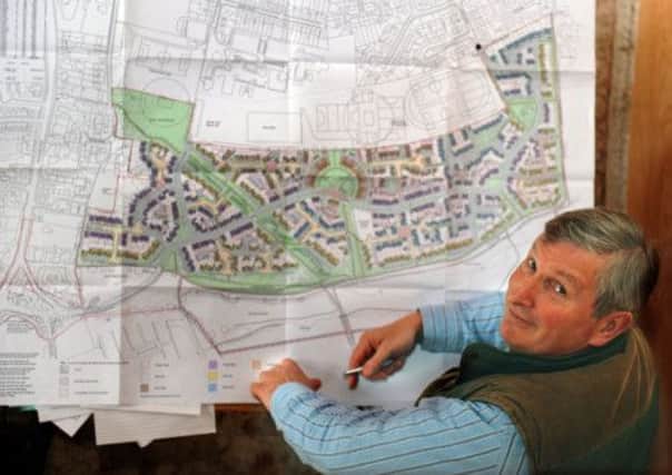 Historian Chas Jones looking at plans for houses on the site of the Battle of Fulford.