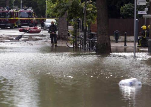 London Fire Brigade in attendance at Half Moon Lane in Herne Hill, London as a burst water main has resulted in severve flooding with water up to a meter deep in some places