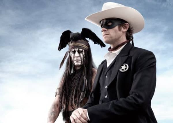 Johnny Depp as Tonto and Armie Hammer as John Reid
