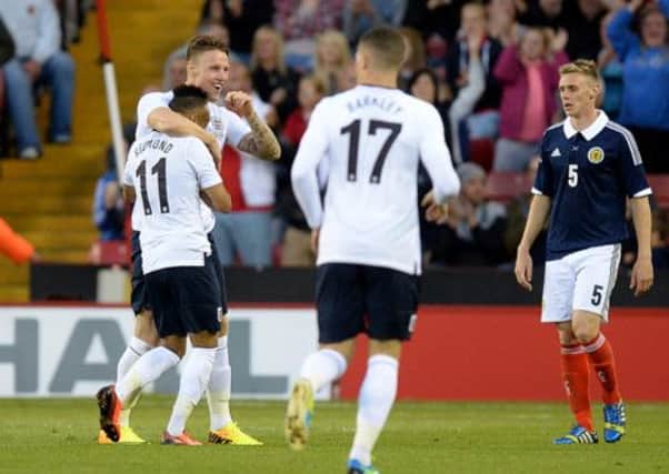 England Connor Wickham (second left) celebrates scoring his side's third goal of the game during the International Friendly match at Bramall Lane, Sheffield. (Picture: Martin Rickett/PA Wire).