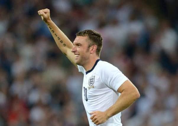 England's Rickie Lambert celebrating scoring his teams third goal of the game.