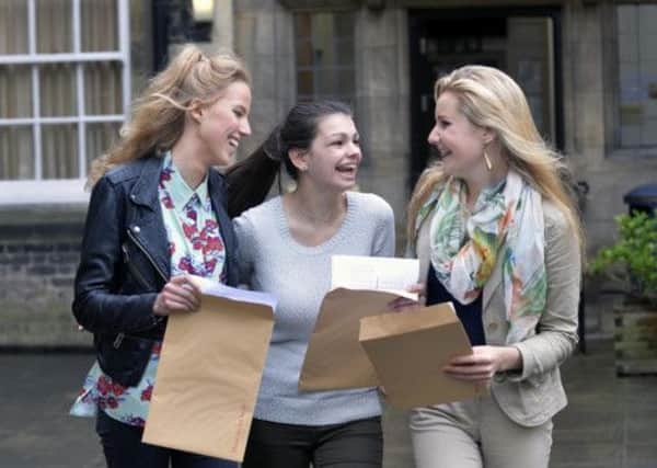 Summer Taylor, Emily Scanu and Rebecca Widdicombe of St Peters School in York open their results.