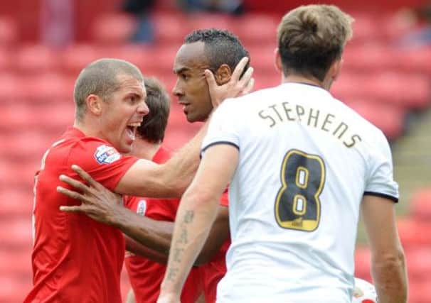 Stephen Dawson, left, celebrates team mate Chris O'Grady, after he scored the first goal of the match.