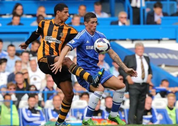 Hull City's Curtis Davies (left) and Chelsea's Fernando Torres battle for the ball