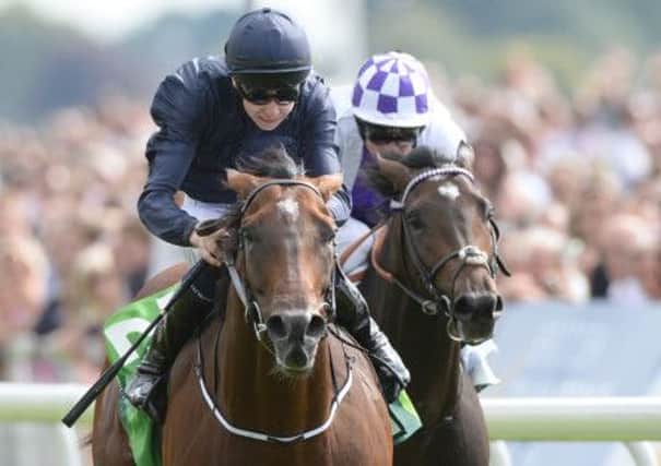 Declaration of War ridden by Joseph O'Brien (left) beats Trading Leather ridden by Kevin Manning to win the Juddmonte International Stakes