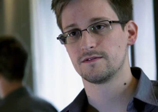 US fugitive Edward Snowden denies being the source of a story in The Independent newspaper on a listening post in Middle East run by British intelligence.