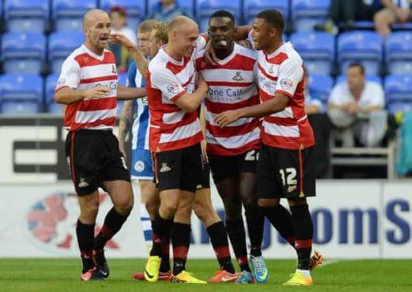 Doncaster Rovers' Theo Robinson (second right) celebrates scoring against Wigan Athletic. Can Doncaster continue their form at Charlton?