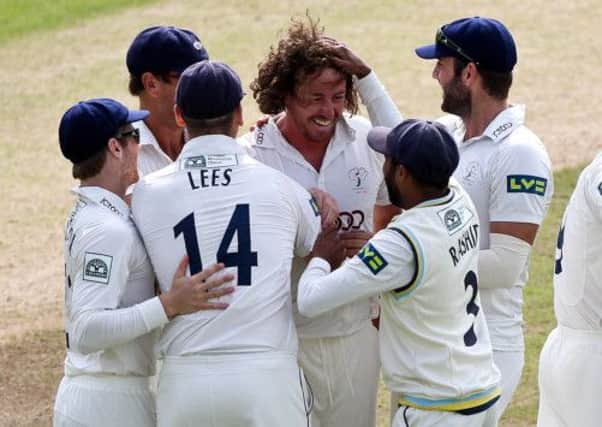 Yorkshire's Ryan Sidebottom (centre) is congratulated on the wicket of Notts' David Hussey. (Picture: Alex Whitehead).