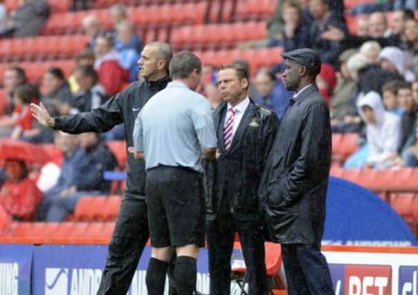 Referee Collins talks  Paul Dickov and Chris Powell
