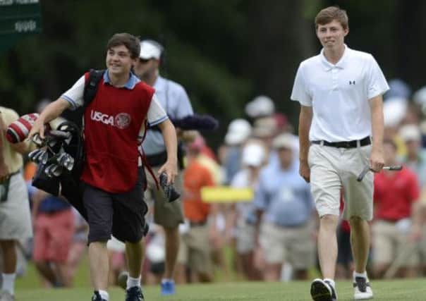 Matthew Fitzpatrick, 18, right, of England. Fitzpatrick's caddie and brother Alex Fitzpatrick is at left.  (AP Photo/Gretchen Ertl)