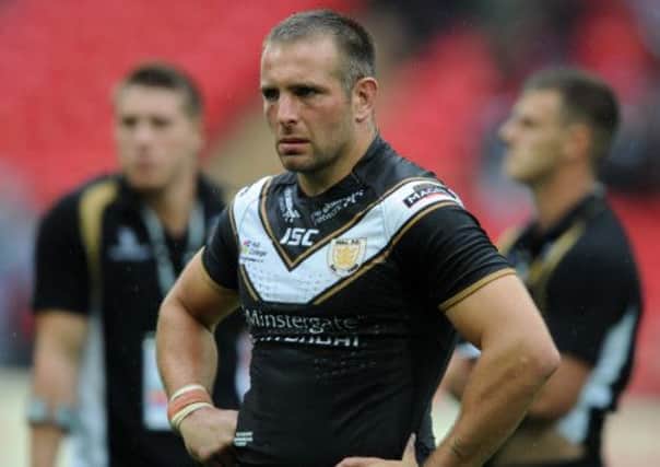 Hull FC's Andy Lynch as Wigan celebrate.