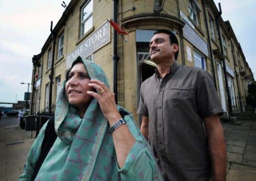 Mrs Zakia Chowdry and son in law Naseer Ahmad who now runs Punjab Stores, Huddersfield