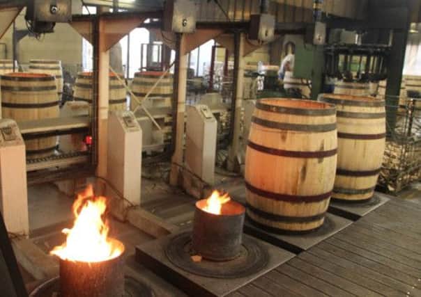 Barrel making in Bordeaux  the barrels add to the cost of a wine.
