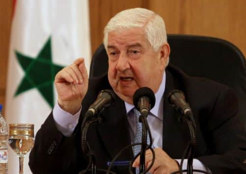 Syrian Foreign Minister Walid al-Moallem speaks during a press conference in Damascus