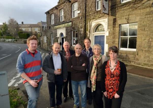 Members of Bamford Community group outside the village pub, The Angler's Rest
