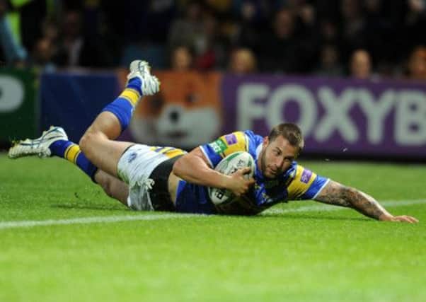 MAIN MAN: Mitch Achurch goes over for a crucial late try for Leeds Rhinos against Catalan Dragons at Headingley last night. Picture: Steve Riding.