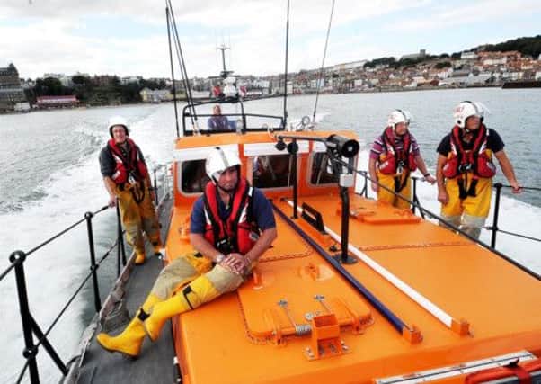 Lifeboat crew members Dave Jackson,Tom Clark (coxswain) Will Cammish, George Willow and Steve Bramham. Picture by Gerard Binks