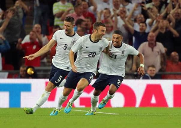 England's Rickie Lambert (centre) celebrates after scoring