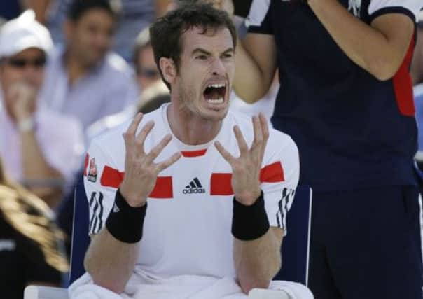 Andy Murray, of Great Britain, reacts during a break between sets