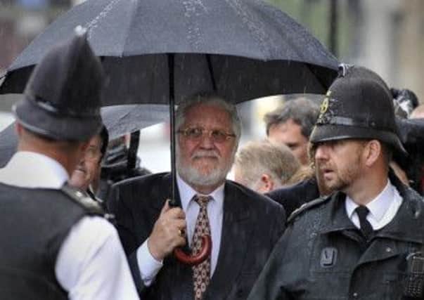 DJ Dave Lee Travis arrives at the Old Bailey for his first appearance at the Crown Court