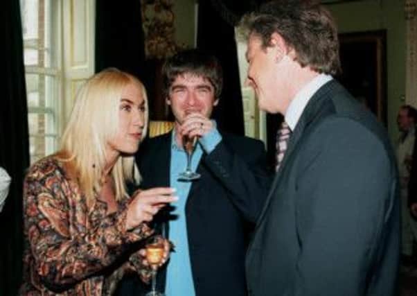 Noel Gallagher and wife Meg talk to then Prime Minister Tony Blair at a Downing Street reception