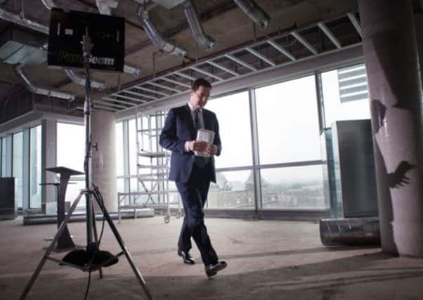 Chancellor George Osborne arrives to make a speech on the present state of the UK economy at a construction site of offices and 'affordable homes' in east London