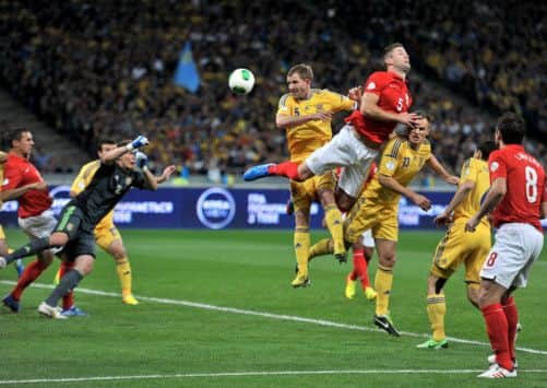 England's Gary Cahill (right) and Ukraine's Olexandr Kucher battle for the ball