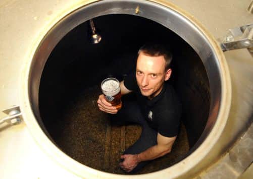 Head brewer Alex Dodds with a pint of Three Swords at Kirkstall Brewery, Leeds