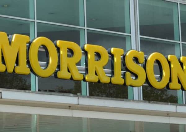 Morrisons has slumped to another six months of sliding profits