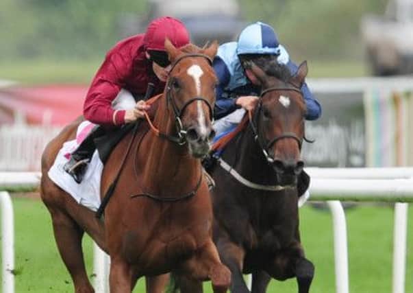 The Lark ridden by Jamie Spencer (centre) wins the DFS Park Hill Stakes