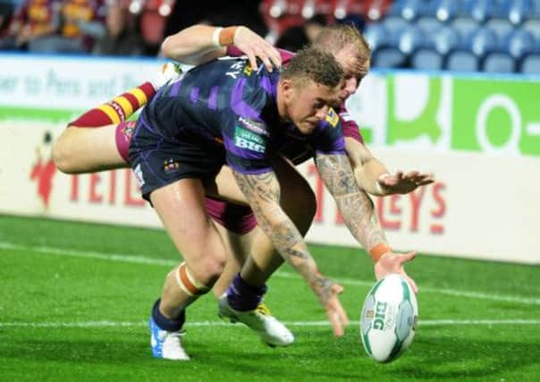 Josh Charnley denies touch down to Aaron Murphy as he scoops the ball out of reach.