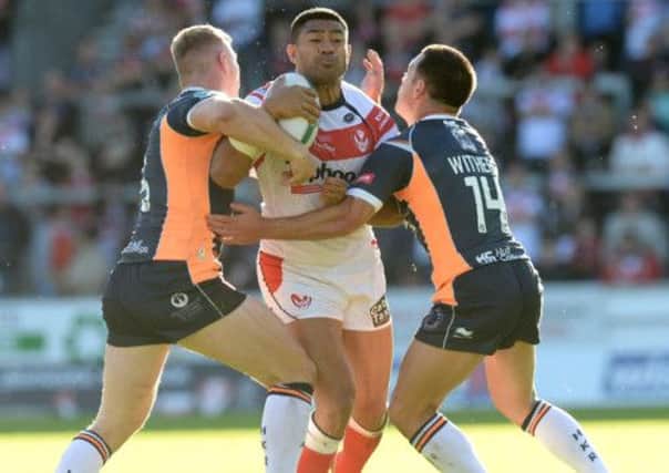 St Helens Willie Manu is tackled by Hull Kingston Rovers' Graeme Horne (left) and Lincoln Withers