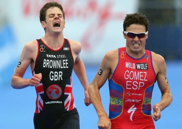 Javier Gomez of Spain out sprints Jonathan Brownlee of Great Britain to win