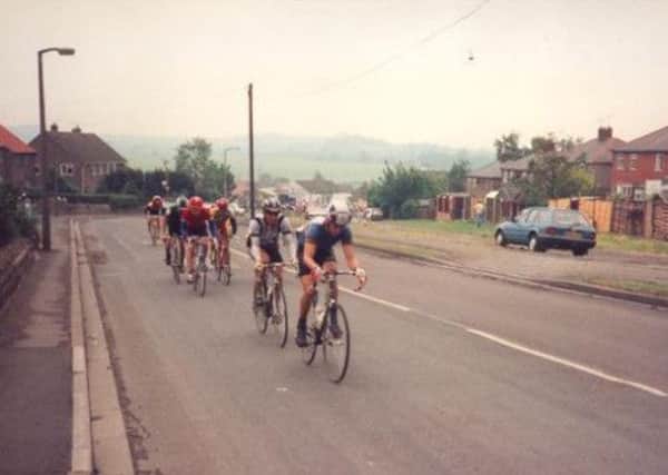THROUGH THE STREETS: 21 years ago riders on the 1992 Milk Race rode through the streets of Kiveton between Rotherham and Sheffield, where a young Dean Downing, inset, and his brother Russell were no doubt watching the action unfold.