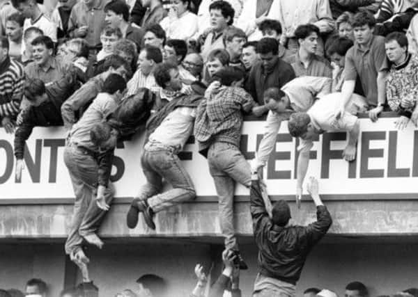 Liverpool fans at Hillsborough, trying to escape overcrowding