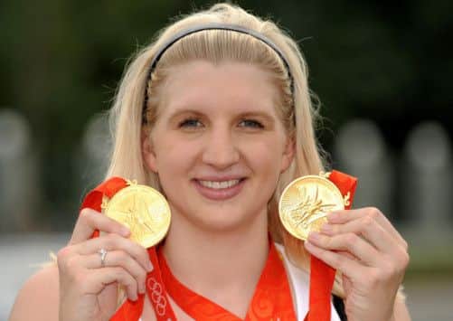 Rebecca Adlington showing off two gold medals