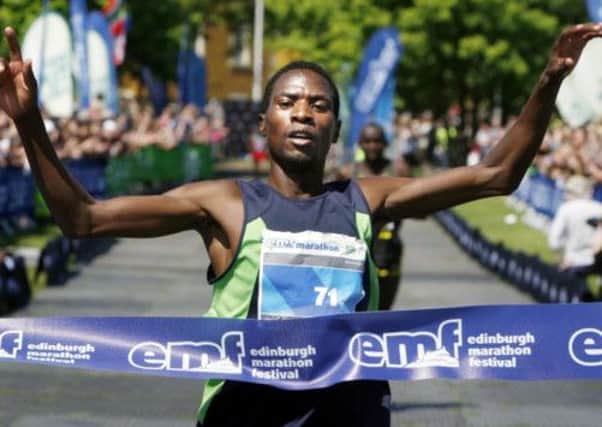 John Mutai crosses the line to win the Edinburgh Marathon.