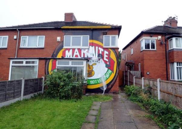 LOVE IT OR HATE IT?: A jar of Marmite painted on Pam Harrisons house. PIC: James Hardisty