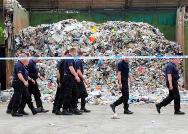 Police at the waste site after the first discovery in 2011. Picture: Ross Parry Agency