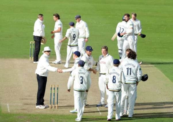 WELL DONE: Yorkshire's players congratulate each other after finishing second in the County Championship table. Picture: Tony Johnson.