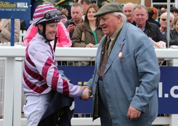 Pat Cosgrave is congratulated by trainer Mick Easterby after  Ancient Cross won The William Hill Ayr Silver Cup at Ayr Racecourse. (Picture: Andrew Milligan/PA Wire)