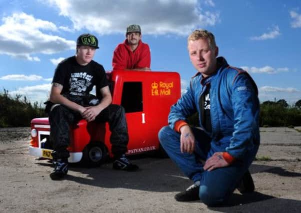 The world's fastest Postman Pat van built by Tom Armitage, left and David Taylor, centre, driven by Ben Rushforth