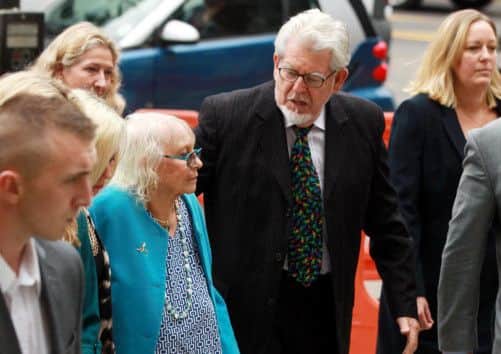 Rolf Harris, with his wife Alwen, arriving at court