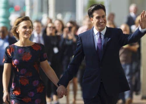 Labour Party Leader Ed Miliband and wife Justine walk to the Brighton Centre