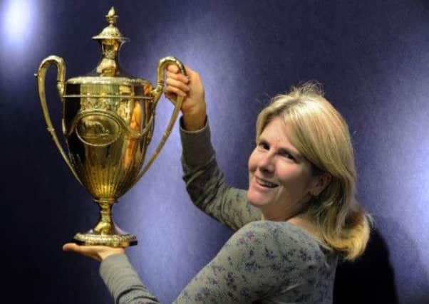 Julia Bourdan-Smith holds the 1794 Richmond Race Cup worth £42,000