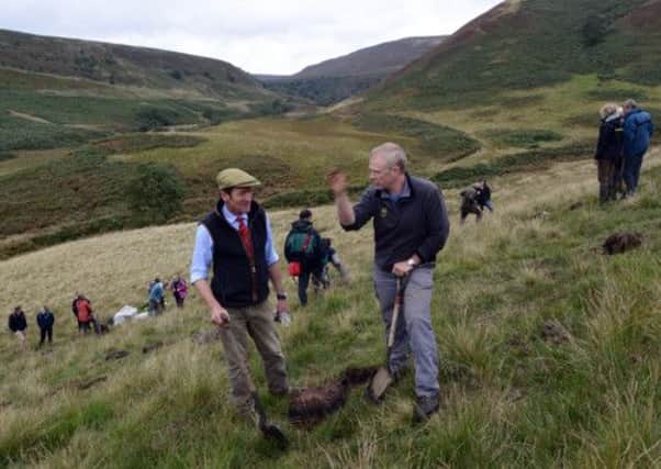 National Trust delegates plant heather seed as part of their 50 year plus vision in the Peak District, and Dame Helen Ghosh, below.  Photos: Nigel Roddis